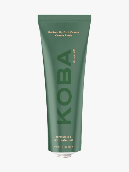Koba Skincare Bottom Up Foot Cream green tube on light gray background